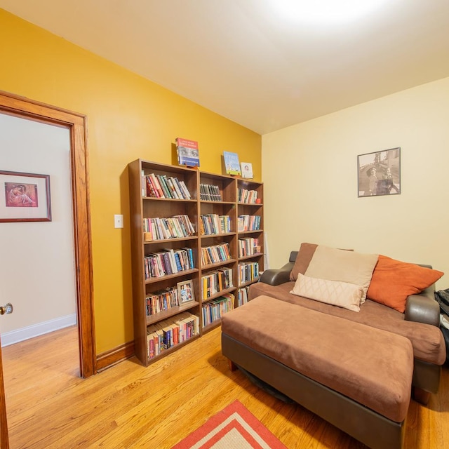 sitting room with wood finished floors and baseboards