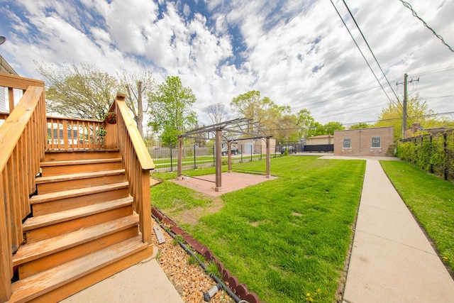 view of yard featuring a deck, stairs, and a patio area