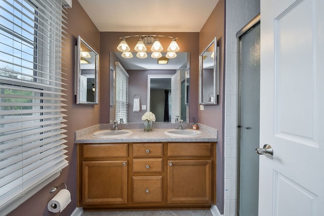 1528 Apache Dr, Naperville, IL 60563 - bathroom featuring double vanity, a shower with door, and a chandelier