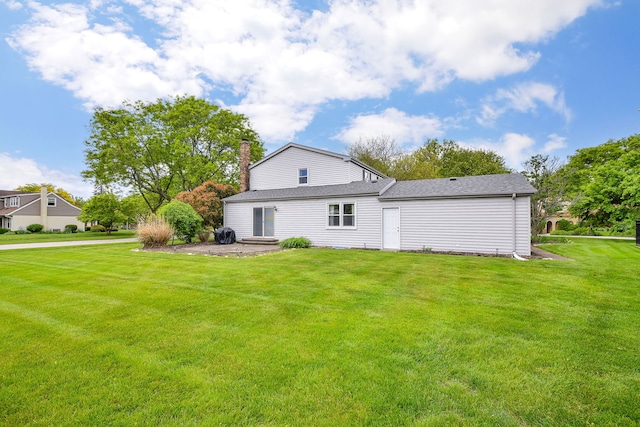 1528 Apache Dr, Naperville, IL 60563 - rear view of property featuring a yard, a chimney, and roof with shingles