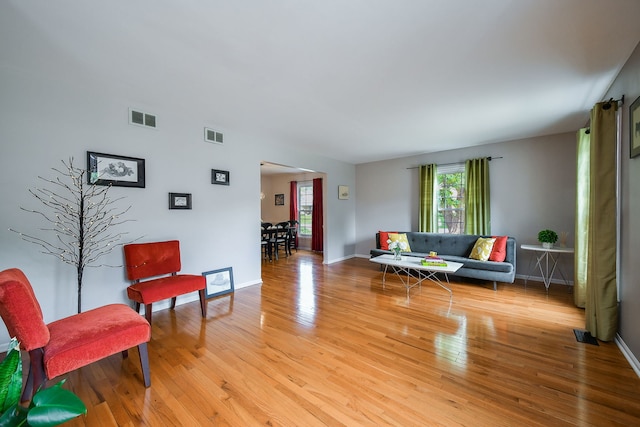 1528 Apache Dr, Naperville, IL 60563 - living room featuring light wood-type flooring and baseboards