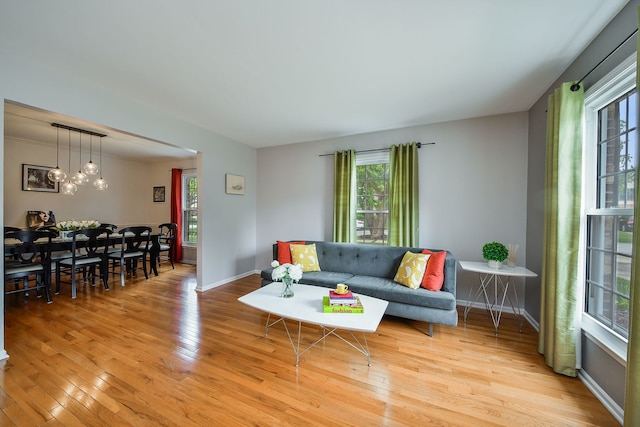 1528 Apache Dr, Naperville, IL 60563 - living area featuring wood finished floors and a chandelier