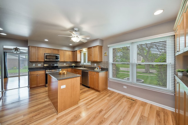 1528 Apache Dr, Naperville, IL 60563 - kitchen featuring stainless steel appliances, a ceiling fan, a center island, dark countertops, and recessed lighting