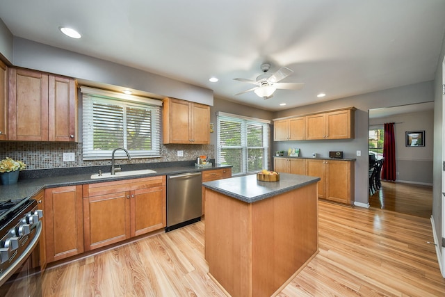 1528 Apache Dr, Naperville, IL 60563 - kitchen with appliances with stainless steel finishes, dark countertops, decorative backsplash, light wood finished floors, and recessed lighting