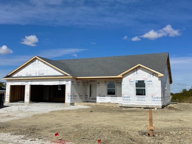 524 Lloyd Dr, Dwight, IL 60420 - unfinished property featuring an attached garage, roof with shingles, covered porch, and driveway