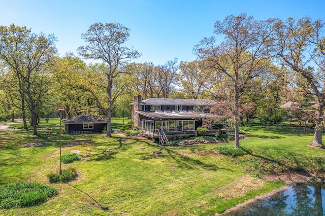 1N341 Indian Knoll Rd, West Chicago, IL 60185 - view of green lawn with a wooden deck and an outbuilding