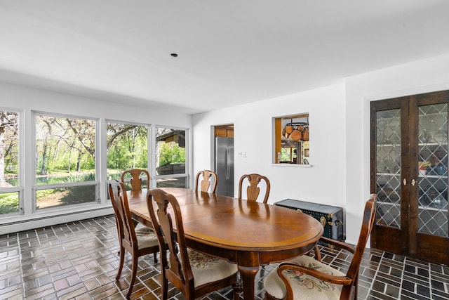 1N341 Indian Knoll Rd, West Chicago, IL 60185 - dining room featuring brick patterned floors, french doors, and a baseboard heating unit