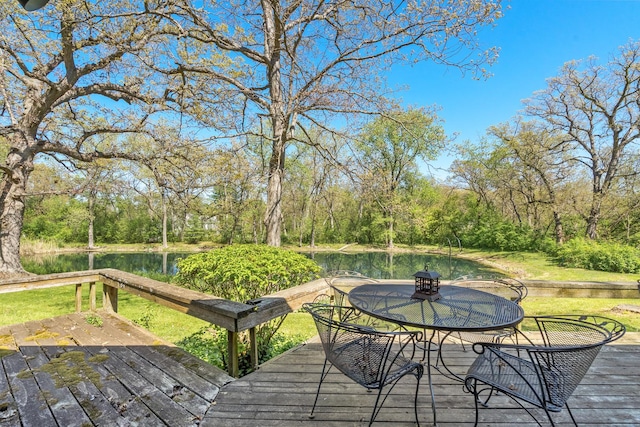 1N341 Indian Knoll Rd, West Chicago, IL 60185 - deck featuring outdoor dining space, a water view, and view of scattered trees