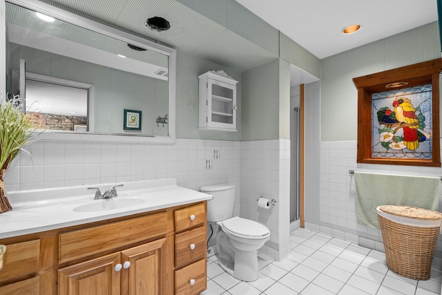 1N341 Indian Knoll Rd, West Chicago, IL 60185 - full bathroom with tile walls, tile patterned flooring, toilet, vanity, and wainscoting