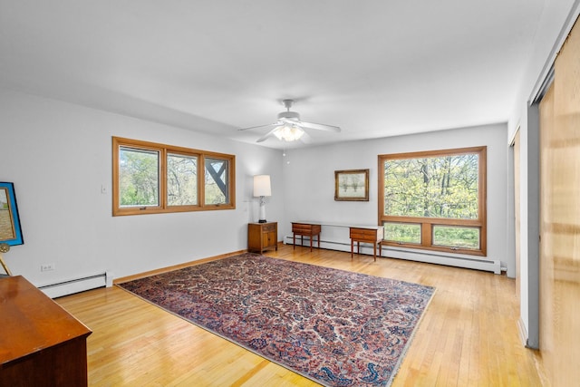1N341 Indian Knoll Rd, West Chicago, IL 60185 - living area featuring a baseboard radiator, a ceiling fan, and light wood-style flooring