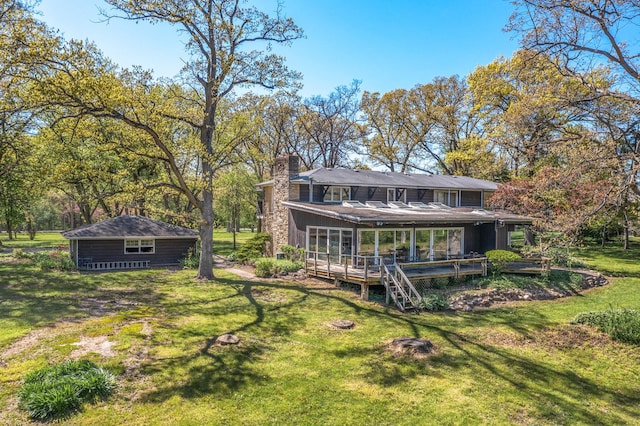 1N341 Indian Knoll Rd, West Chicago, IL 60185 - rear view of house featuring a chimney, a yard, and a wooden deck