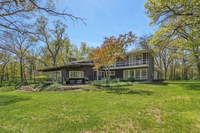 1N341 Indian Knoll Rd, West Chicago, IL 60185 - rear view of property with a sunroom, a yard, and a chimney