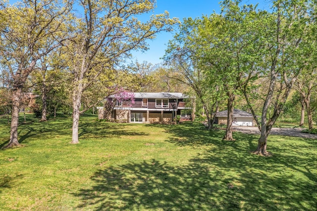 1N341 Indian Knoll Rd, West Chicago, IL 60185 - view of green lawn with a deck and asphalt driveway