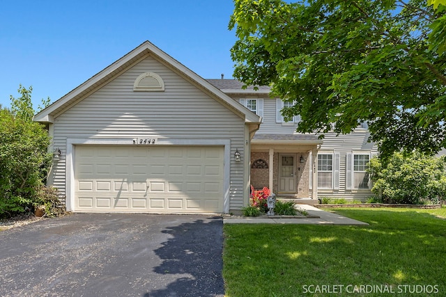 2442 La Costa Ct, Aurora, IL 60503 - view of front facade featuring driveway, a front lawn, an attached garage, and brick siding