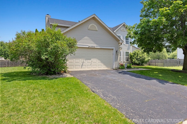 2442 La Costa Ct, Aurora, IL 60503 - view of front of house with driveway, an attached garage, and a chimney