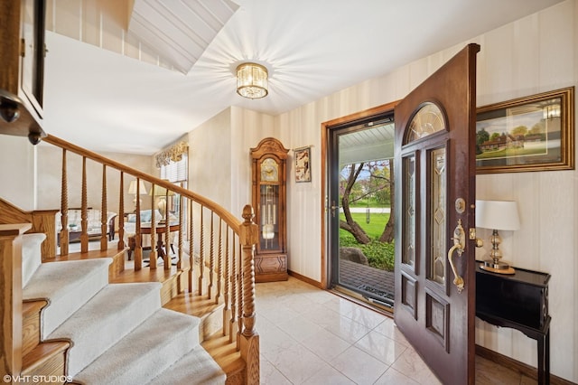 403 Minnaqua Dr, Prospect Heights, IL 60070 - entryway with stairway, wallpapered walls, baseboards, and a chandelier