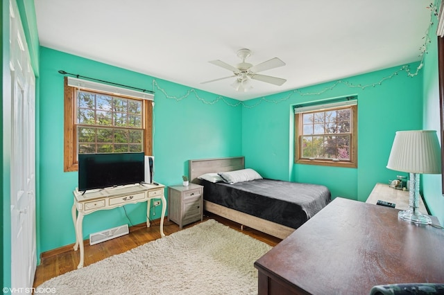 403 Minnaqua Dr, Prospect Heights, IL 60070 - bedroom with wood finished floors, a ceiling fan, and baseboards