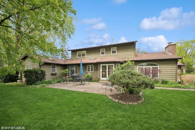 403 Minnaqua Dr, Prospect Heights, IL 60070 - back of house featuring a patio area, a yard, a chimney, and roof with shingles