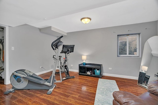 workout room with wood finished floors and baseboards