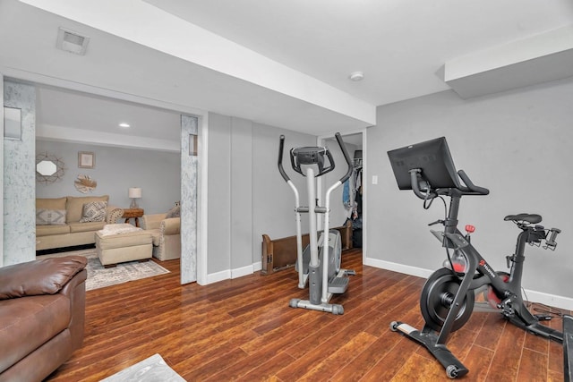 workout area with wood finished floors and baseboards
