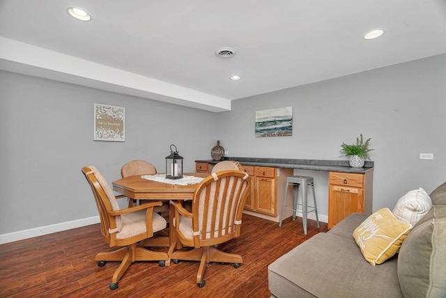 dining area with baseboards, recessed lighting, and dark wood finished floors