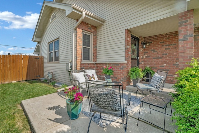 view of patio / terrace with fence and an outdoor hangout area