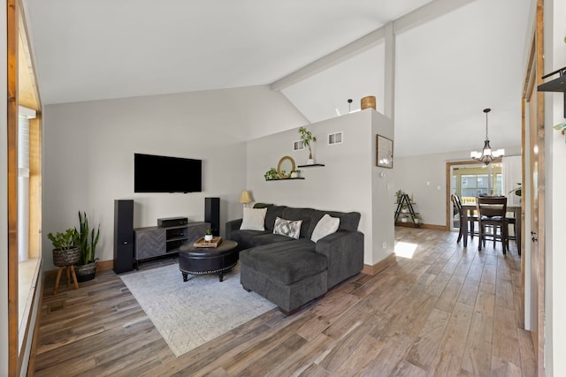 5306 Whisper Meadow Ct, Plainfield, IL 60586 - living room featuring a chandelier, wood finished floors, baseboards, beamed ceiling, and high vaulted ceiling