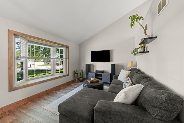 5306 Whisper Meadow Ct, Plainfield, IL 60586 - living area featuring wood finished floors, vaulted ceiling, and baseboards