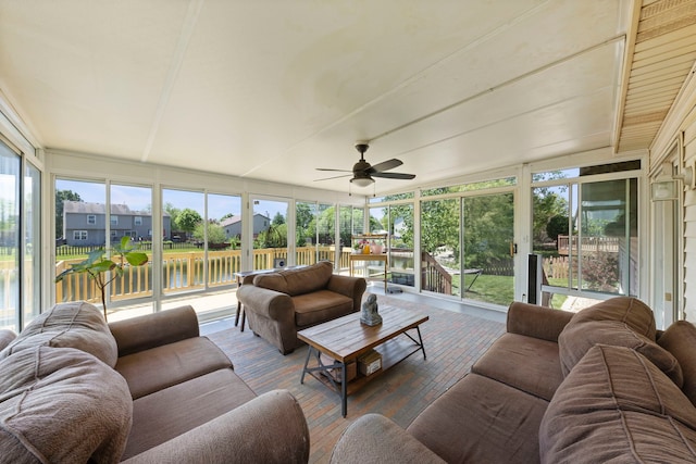 5306 Whisper Meadow Ct, Plainfield, IL 60586 - sunroom featuring an outdoor living space, a ceiling fan, expansive windows, and a water view