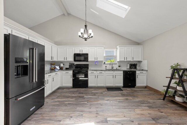 5306 Whisper Meadow Ct, Plainfield, IL 60586 - kitchen featuring black appliances, a chandelier, high vaulted ceiling, white cabinets, and beamed ceiling