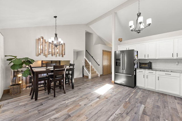 5306 Whisper Meadow Ct, Plainfield, IL 60586 - kitchen featuring high end refrigerator, a chandelier, light wood-type flooring, backsplash, and white cabinetry