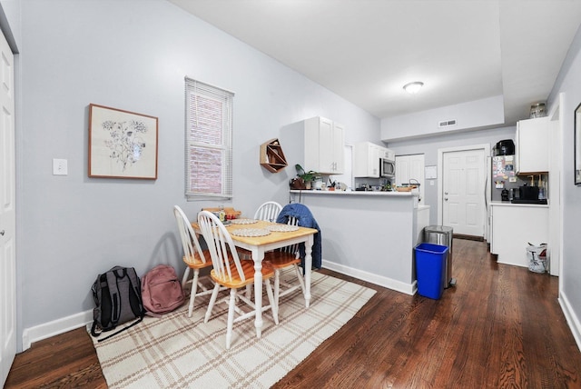 934 N Noble St, Chicago, IL 60642 - dining area with dark wood finished floors and baseboards