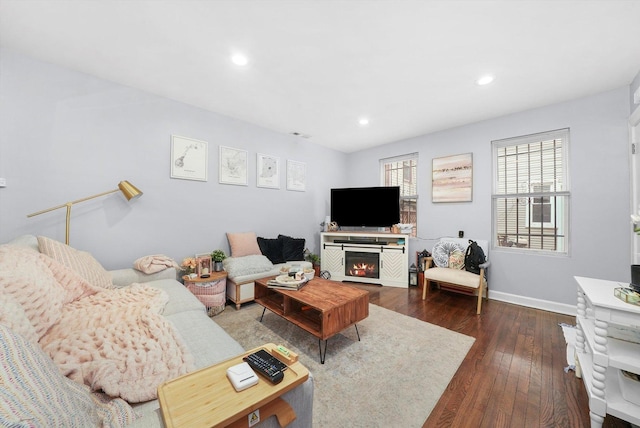 934 N Noble St, Chicago, IL 60642 - living room with dark wood-type flooring, recessed lighting, baseboards, and a glass covered fireplace