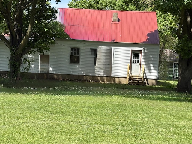 953 11th St N, Rochelle, IL 60168 - rear view of property with entry steps, a yard, metal roof, and a water view