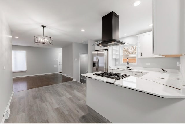 126 Strieff Ave, Chicago Heights, IL 60411 - kitchen featuring stainless steel fridge, island range hood, gas stovetop, a sink, and white cabinets