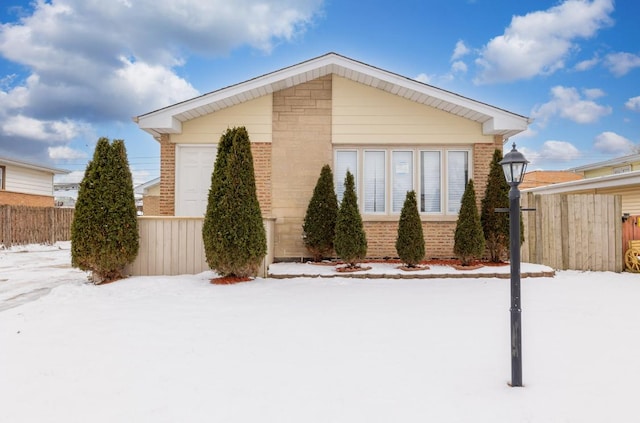 126 Strieff Ave, Chicago Heights, IL 60411 - view of snow covered exterior with brick siding