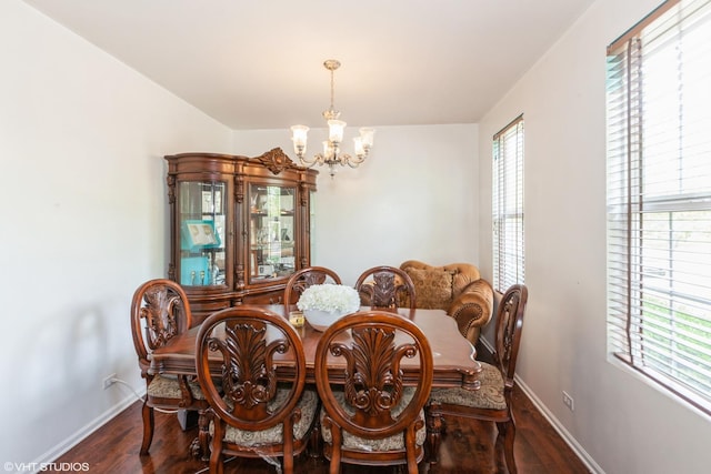 554 Truman Dr, Oswego, IL 60543 - dining space featuring a chandelier, wood finished floors, and baseboards