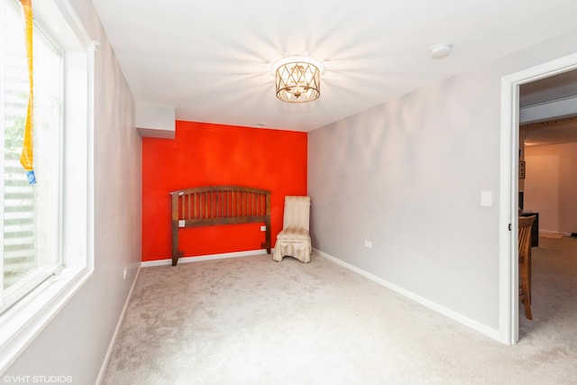 554 Truman Dr, Oswego, IL 60543 - unfurnished bedroom with carpet floors, baseboards, and a chandelier