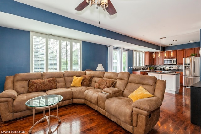 554 Truman Dr, Oswego, IL 60543 - living area with dark wood-style flooring and a ceiling fan