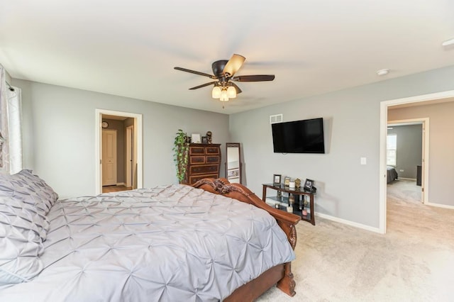 carpeted bedroom with baseboards and ceiling fan