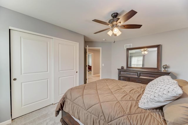 bedroom featuring carpet floors, a closet, and ceiling fan