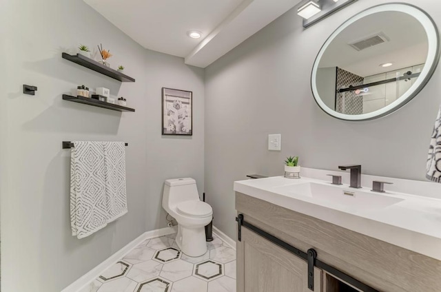 bathroom featuring toilet, baseboards, vanity, a shower, and recessed lighting