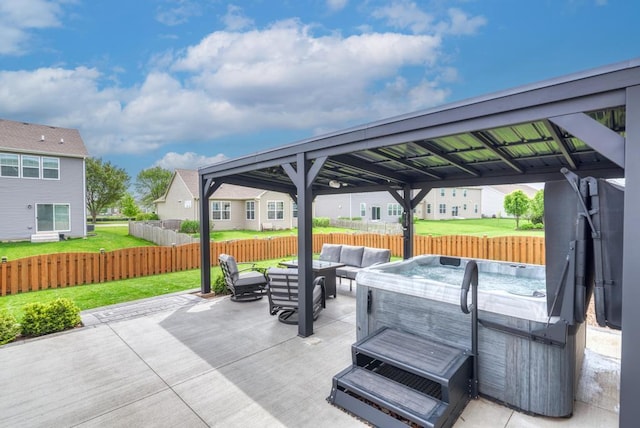 view of patio with an outdoor hangout area, a hot tub, and a gazebo