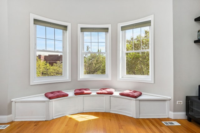 unfurnished room featuring light wood-type flooring and baseboards