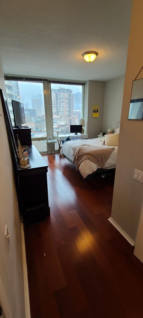 bedroom with wood finished floors