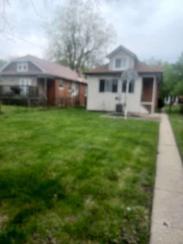 view of front of home with a front lawn