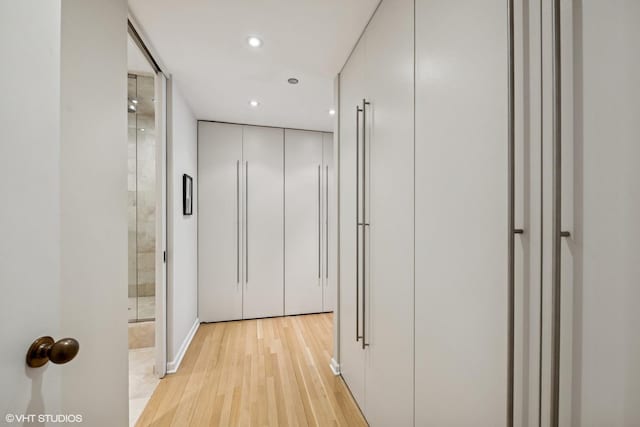 corridor with recessed lighting and light wood-type flooring