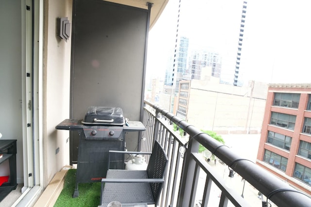 balcony with a grill and a view of city