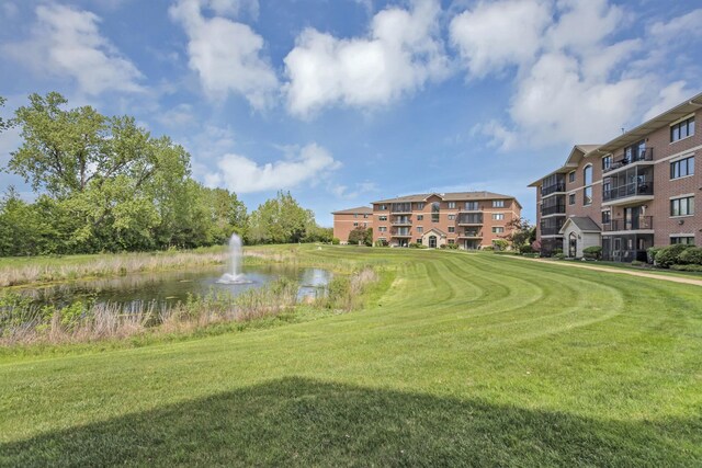 6850 W Winding Trl Unit 406, Oak Forest, IL 60452 - view of property's community with a water view and a yard