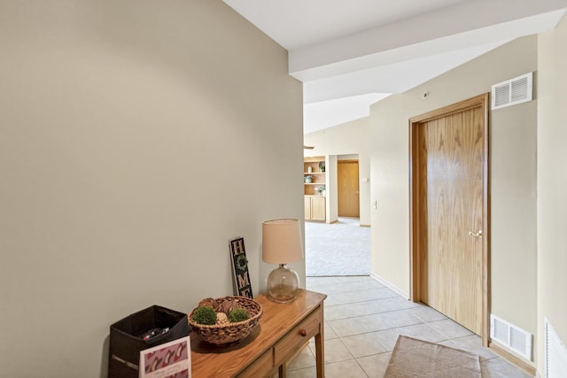 6850 W Winding Trl Unit 406, Oak Forest, IL 60452 - corridor with light tile patterned floors, baseboards, vaulted ceiling, and light colored carpet
